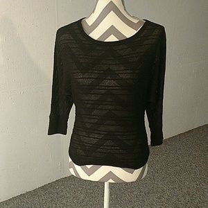 Black 3/4 sleeve shirt.